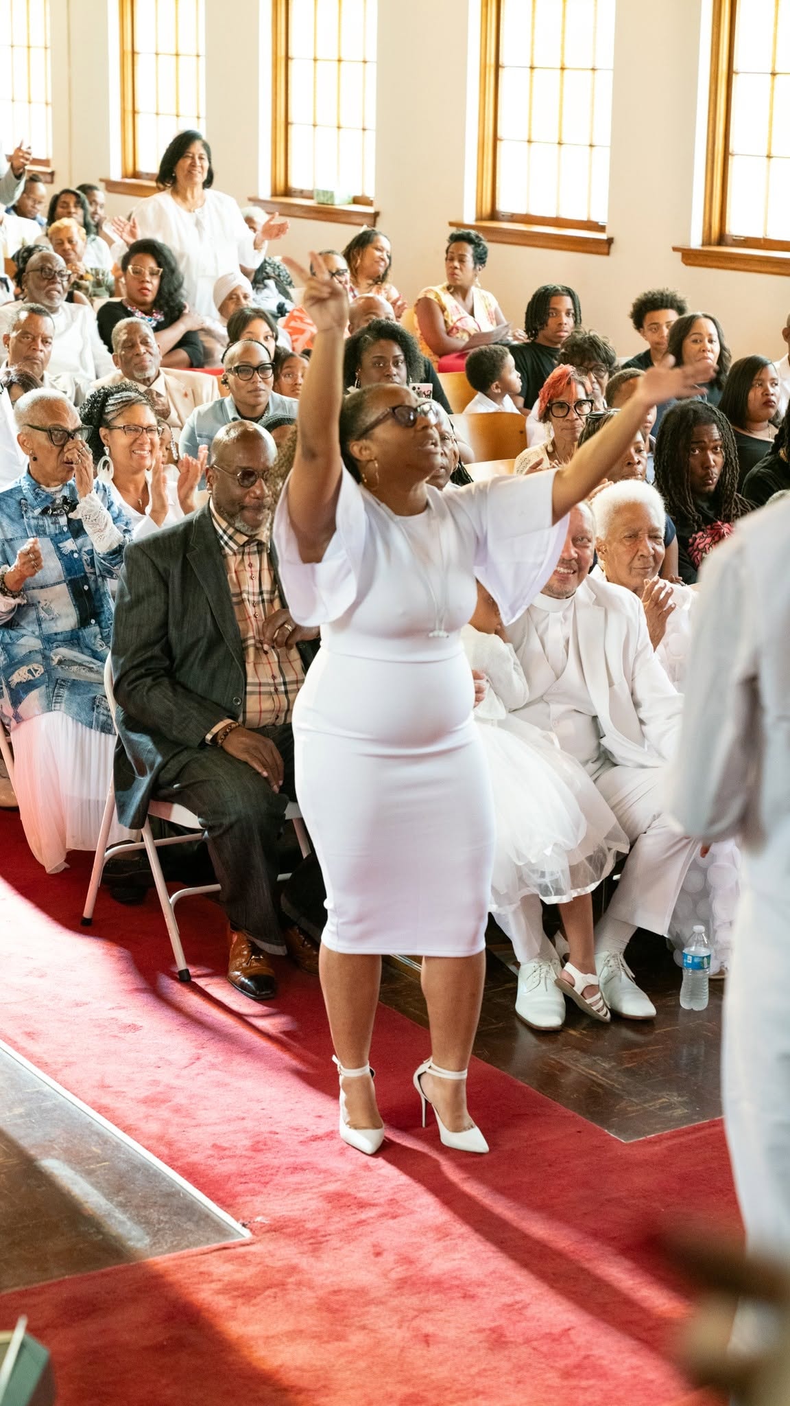 Hands raised in praise — the congregation on fire